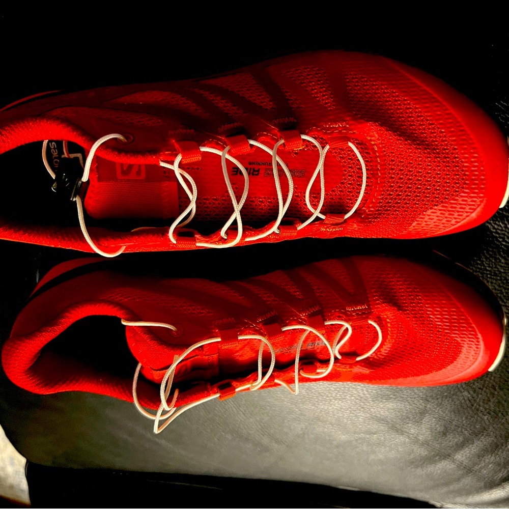 Salomon like new size 9 women size 7 men, red hiking sneakers.